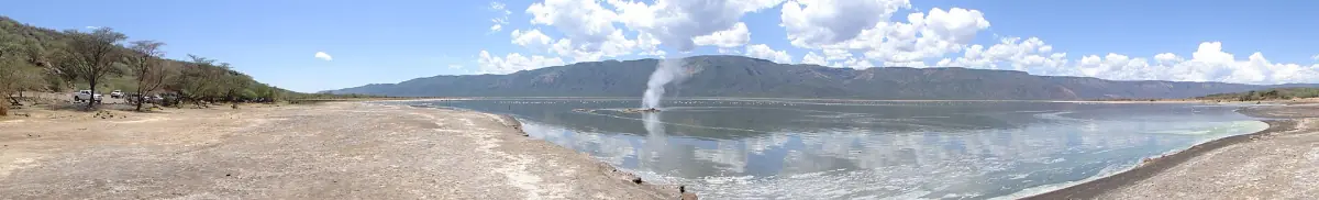 Steam rising from hot springs along the shore of Lake Bogoria