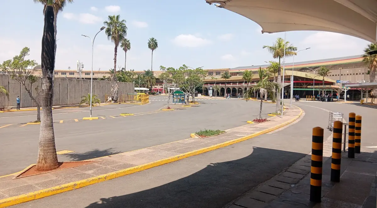 Entrance road and covered forecourt at Nairobi airport in daylight