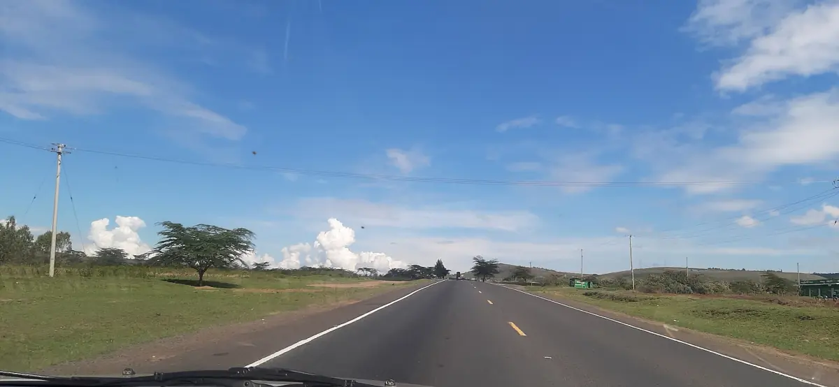Nairobi to Nakuru highway running through open land under blue sky
