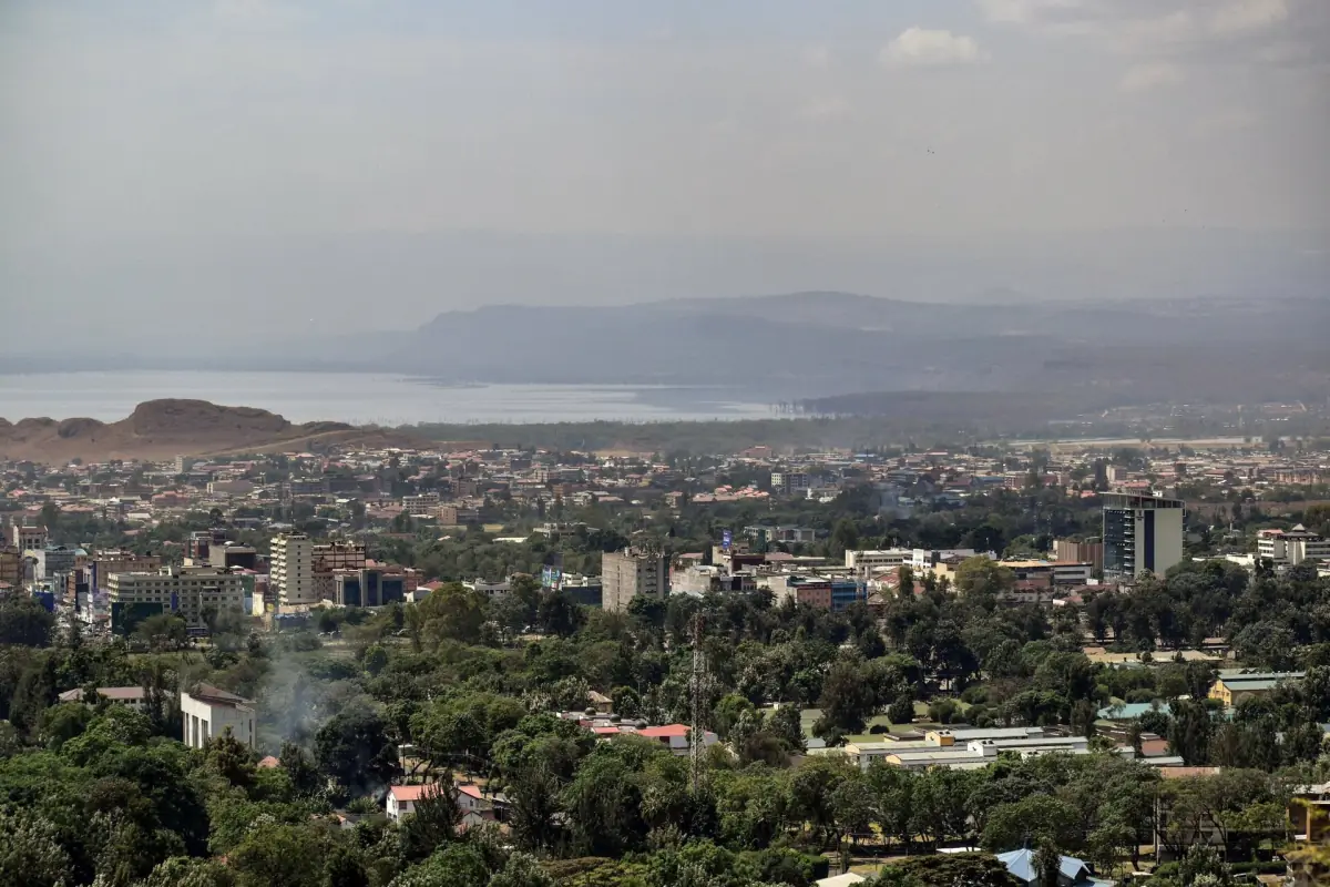 Rooftops of Nakuru town with Lake Nakuru in the hazy distance