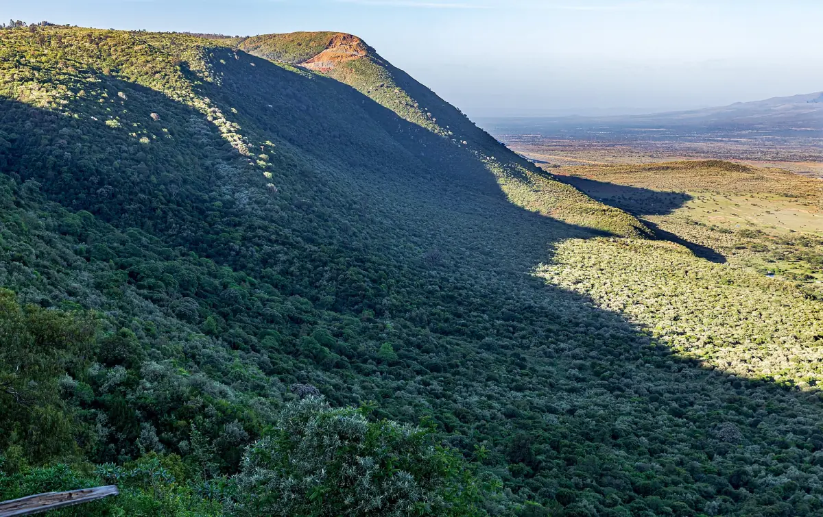 Sunlit slope of the Rift Valley wall above the dry valley floor
